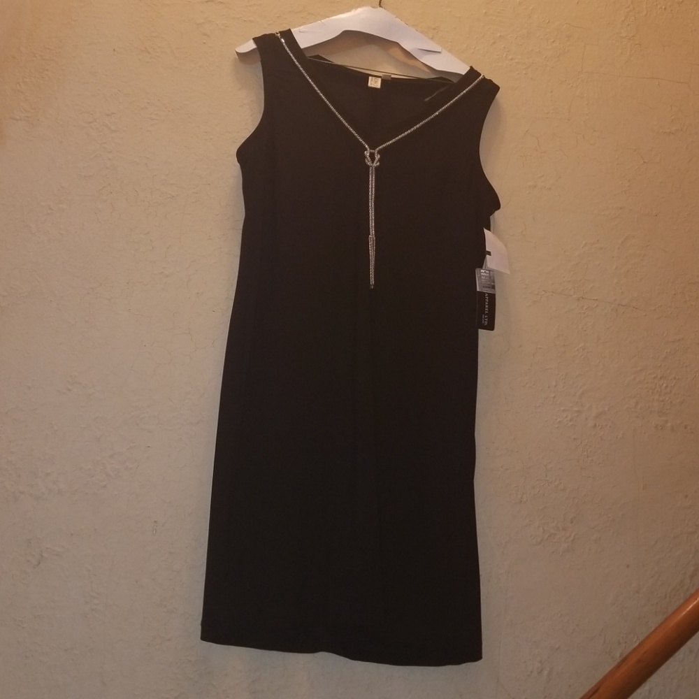 Black cocktail dress with silver accent necklace